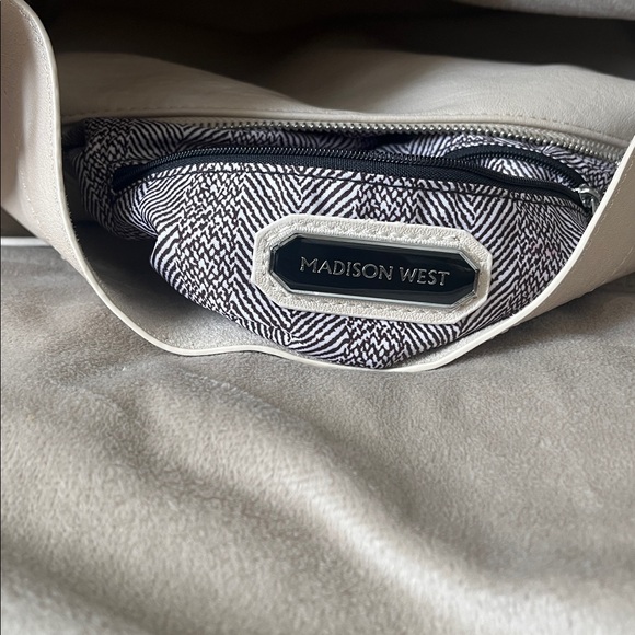 Madison West Purse in a purse
Cream purse w/ silver details. - Picture 5 of 6